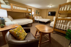 deer run lower level bunk room showing two bunk beds and pull out couch.