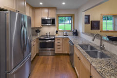 kitchen with stainless steel appliances and granite counter top.