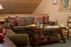 Mountain Top Resort Grand Vista Guest House upstairs loft seating area with couch and table.