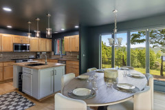 view of dining area and kitchen to see the whole room and view of the mountains.