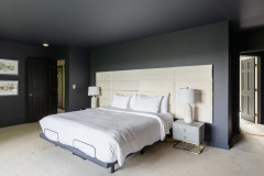 master bedroom featuring large bed with headboard.