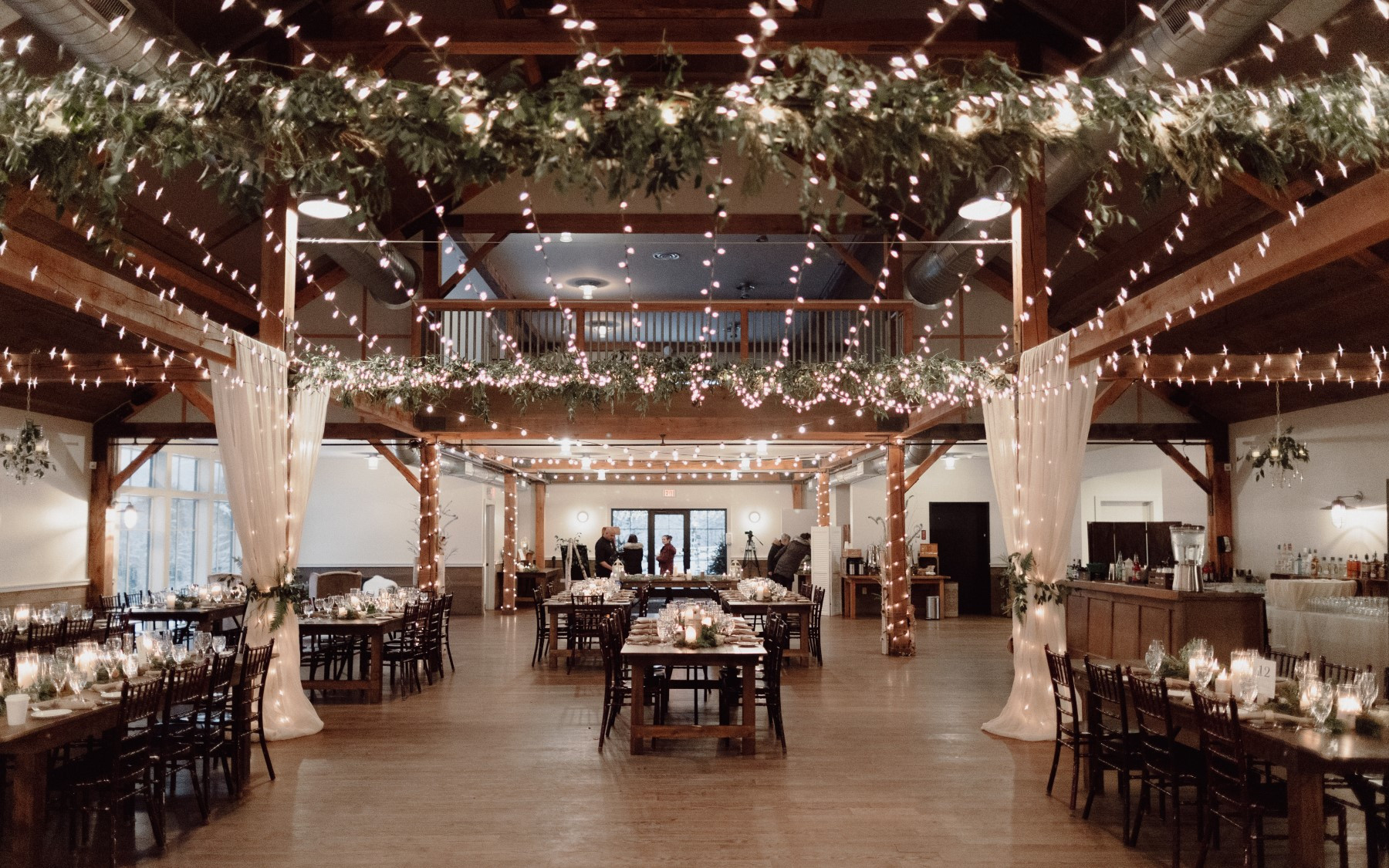 event barn decorated for a winter wedding with drapery