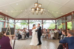 bride and groom doing a first dance at the beach pavilion.