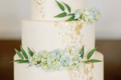 White wedding cake with blue flowers