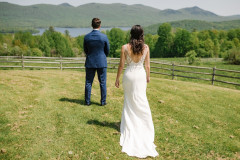 first look photo of bride and groom in spring with mountains behind