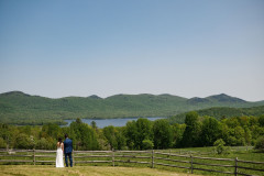 photo of bride and groom overlooking Green Mountains and lake