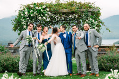 bride and groom in front of wedding knoll with wedding party.