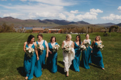 bride walking towards camera with three bridesmaids on each side. 