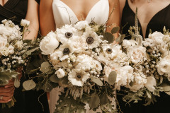 close up photo of white floral bridal and bridesmaids bouquets.