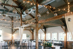 event barn interior with disco balls hanging from ceiling