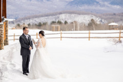 bride and groom exchanging private vows with mountain scape behind.