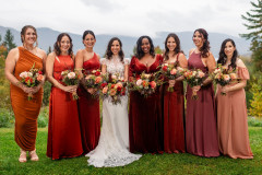 bride and bridesmaids with floral bouquets.
