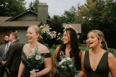 bridesmaids with bouquets smiling