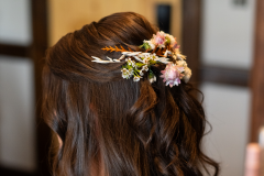 wedding hair on bride done with hair florals.